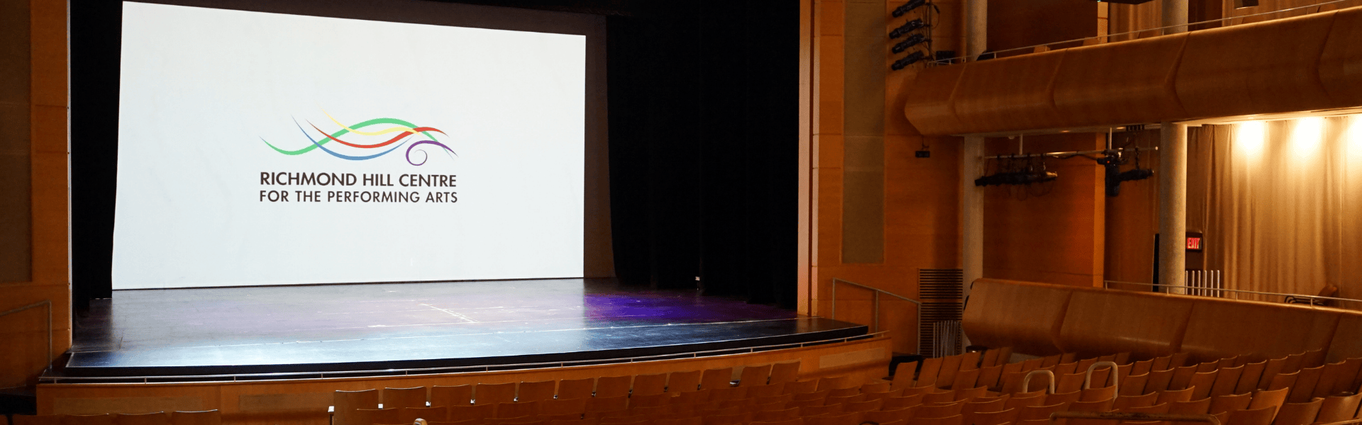 RHCPA logo on Main Stage screen with rows of theatre seating