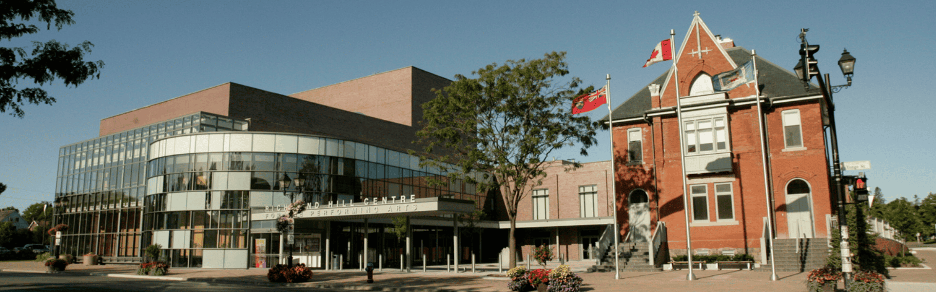 Exterior photo of theatre on clear blue sky day