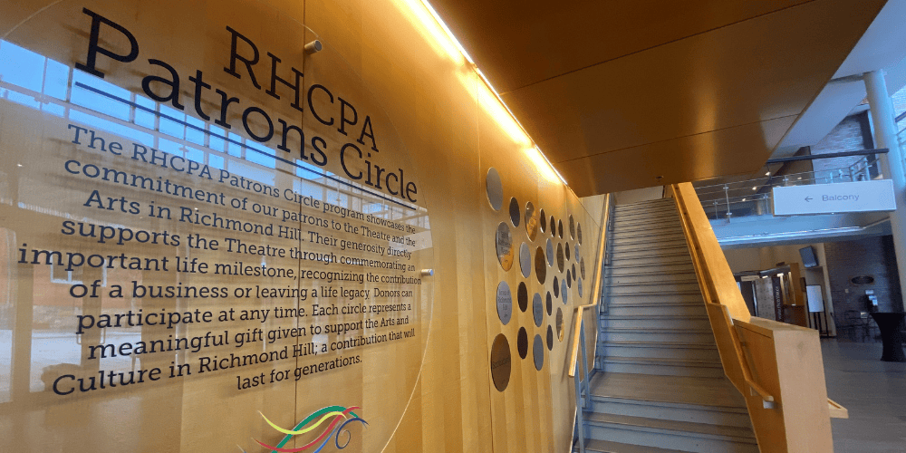 Circular plaques displayed on wood finish wall